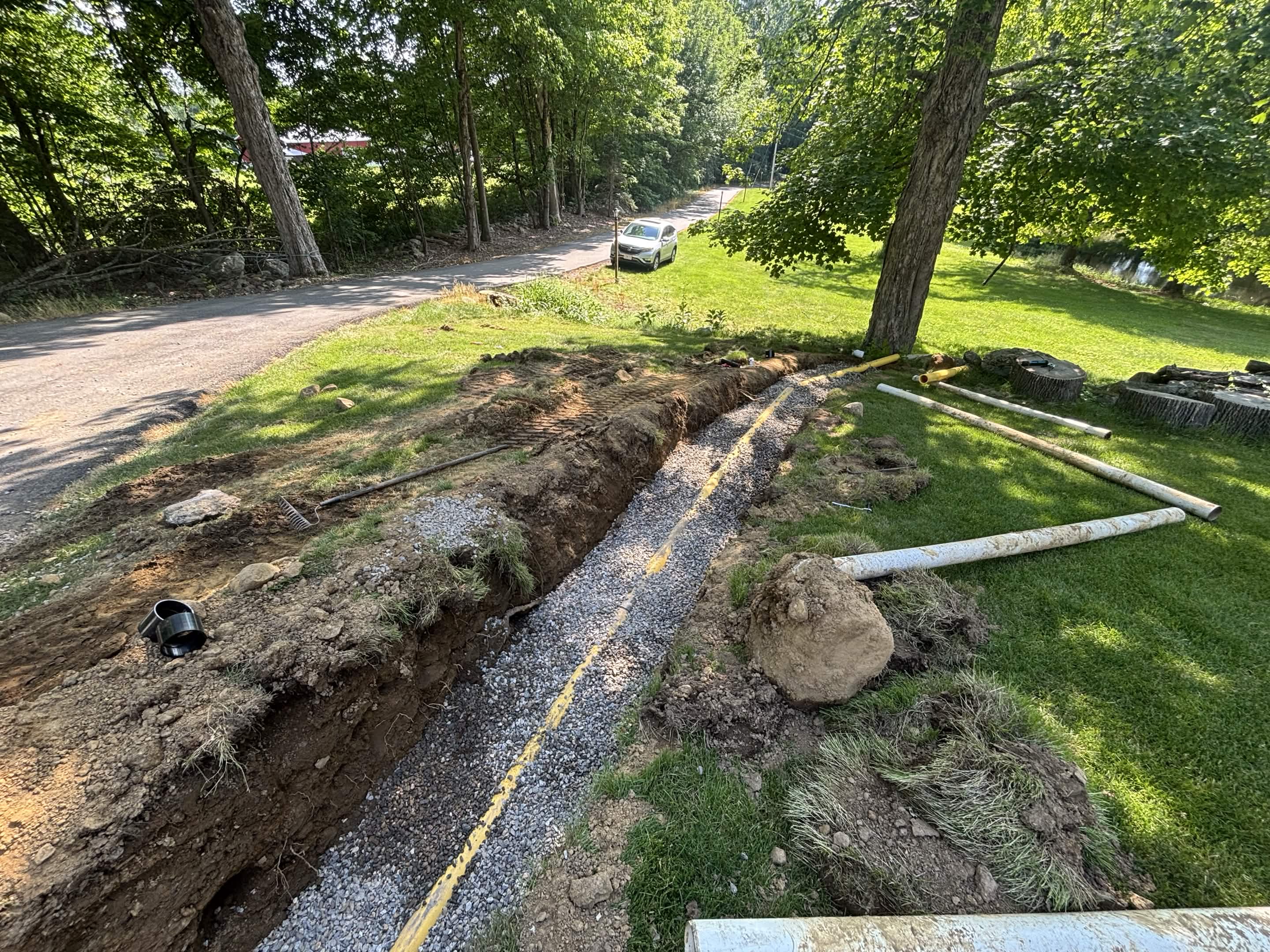 Drain system completed — pipe run to pond outlet